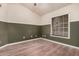Bedroom with laminate flooring, a window and neutral paint at 845 N Oak Ct, Chandler, AZ 85226