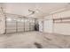 Spacious two-car garage with plenty of storage cabinets and a garage door opener at 845 N Oak Ct, Chandler, AZ 85226