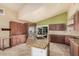 Modern kitchen with a large island featuring granite countertops and ample cabinet space at 845 N Oak Ct, Chandler, AZ 85226