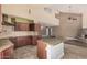 Contemporary kitchen with granite countertops, tile backsplash, and stainless steel appliances at 845 N Oak Ct, Chandler, AZ 85226