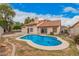 A backyard view shows a kidney-shaped pool with surrounding patio and lush landscaping at 845 N Oak Ct, Chandler, AZ 85226