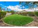 Expansive backyard featuring well-maintained lawn and mature landscaping for privacy at 8603 E Aster Dr, Scottsdale, AZ 85260