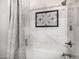 Updated bathroom with white subway tiles, a shower, and decorative accents at 8603 E Aster Dr, Scottsdale, AZ 85260