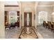 Inviting foyer with marble floors, a decorative front door, and views into the living spaces at 8603 E Aster Dr, Scottsdale, AZ 85260