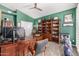 A stylish home office with built-in bookshelves, creating a professional workspace at 8603 E Aster Dr, Scottsdale, AZ 85260