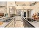 Spacious kitchen showcasing stainless steel appliances, granite countertops, and ample cabinet space at 8603 E Aster Dr, Scottsdale, AZ 85260
