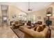 Inviting living room with tile floors, fireplace, comfortable seating, and ample natural light at 8603 E Aster Dr, Scottsdale, AZ 85260