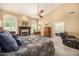 Cozy main bedroom featuring a fireplace, seating area, and en-suite bathroom access at 8603 E Aster Dr, Scottsdale, AZ 85260