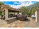 A luxurious outdoor living space with a hot tub, covered patio, and outdoor kitchen at 8603 E Aster Dr, Scottsdale, AZ 85260