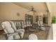 Covered patio featuring ample seating and ceiling fan, perfect for outdoor lounging and entertaining at 8603 E Aster Dr, Scottsdale, AZ 85260