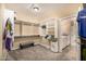 Walk-in closet featuring custom built-in shelves and carpeted floors for storage at 8603 E Aster Dr, Scottsdale, AZ 85260