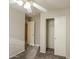 This carpeted bedroom features a ceiling fan and closet with sliding doors at 8832 W Manzanita Dr, Peoria, AZ 85345