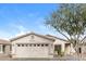 Charming single-story home featuring a neutral color scheme, desert landscaping, and a two-car garage at 8832 W Manzanita Dr, Peoria, AZ 85345