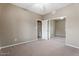 Neutral bedroom featuring a mirrored closet and carpet at 9600 N 96Th St # 263, Scottsdale, AZ 85258