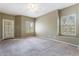 Spacious bedroom features neutral color palette, carpet and shuttered windows for natural light at 9600 N 96Th St # 263, Scottsdale, AZ 85258