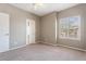 Neutral bedroom with a large window with plantation shutters and closet at 9600 N 96Th St # 263, Scottsdale, AZ 85258
