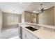 Open-concept kitchen featuring a breakfast bar, stainless steel appliances, and seamless flow into the adjacent living area at 9600 N 96Th St # 263, Scottsdale, AZ 85258