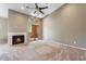 Bright Living room features a fireplace, sliding glass doors and large ceiling fan at 9600 N 96Th St # 263, Scottsdale, AZ 85258