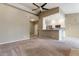 Open concept living room and kitchen featuring neutral walls and carpet at 9600 N 96Th St # 263, Scottsdale, AZ 85258