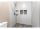 Contemporary walk-in shower featuring mosaic accents, built-in shelves, and modern fixtures for a spa-like experience at 9600 N 96Th St # 263, Scottsdale, AZ 85258
