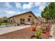 Large backyard with a patio area, garden, shed, and mature tree offering ample outdoor living space at 10226 W Country Club Trl, Peoria, AZ 85383