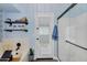 Stylish bathroom featuring a soaking tub, glass enclosed shower and a bright white door to the outside at 10226 W Country Club Trl, Peoria, AZ 85383