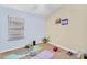 Inviting bedroom with yoga mats, natural light, and art at 10226 W Country Club Trl, Peoria, AZ 85383