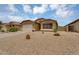 Inviting single-story home with a two-car garage, low-maintenance landscaping, and cozy front yard at 10226 W Country Club Trl, Peoria, AZ 85383