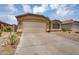 Charming single-story home with a two-car garage, desert landscaping, and a welcoming entrance at 10226 W Country Club Trl, Peoria, AZ 85383