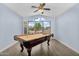 Game room with pool table and large window providing great view of neighborhood at 10226 W Country Club Trl, Peoria, AZ 85383