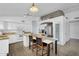 Bright kitchen featuring granite countertops, stainless steel appliances, and white cabinetry at 10226 W Country Club Trl, Peoria, AZ 85383