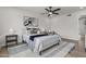 Bright bedroom featuring a ceiling fan, warm natural light, and contemporary decor and furnishings at 10612 N 48Th Ave, Glendale, AZ 85304