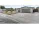Inviting single-story home with desert landscaping, a two-car garage, and spacious driveway at 10612 N 48Th Ave, Glendale, AZ 85304
