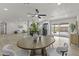 Open floor plan showcasing the dining area, kitchen, and living room with abundant natural light and modern finishes at 10612 N 48Th Ave, Glendale, AZ 85304