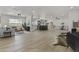 Spacious open floor plan features a modern kitchen, dining area, and stylish living room with natural light at 10612 N 48Th Ave, Glendale, AZ 85304