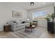 Comfortable living room with a cozy sofa, stylish decor, and natural light, creating an inviting atmosphere at 10612 N 48Th Ave, Glendale, AZ 85304