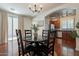 Cozy dining area with a round table, seating for four, and views into the kitchen at 1086 S Nancy Ln, Gilbert, AZ 85296