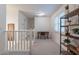 Upstairs landing area with a desk, shelves, and a window providing natural light at 1086 S Nancy Ln, Gilbert, AZ 85296