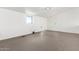 Modern basement with grey tile flooring, white walls, and natural light from above ground windows at 1111 W University Dr # 3016, Tempe, AZ 85281