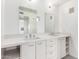 Modern bathroom featuring double sinks, ample counter space, and sleek white cabinetry at 1111 W University Dr # 3016, Tempe, AZ 85281