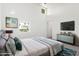 Modern bedroom with neutral tones, decorative throw pillows, and ample natural light streaming through the window at 1111 W University Dr # 3016, Tempe, AZ 85281