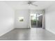 Well-lit bedroom featuring tiled flooring, a sliding glass door, and views of the outside at 1111 W University Dr # 3016, Tempe, AZ 85281