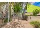 Modern gated entrance with secure fencing, desert landscaping, and sleek architecture for a safe and inviting community at 1111 W University Dr # 3016, Tempe, AZ 85281