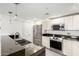 Modern kitchen with stainless steel appliances, granite countertops, and white cabinets at 1111 W University Dr # 3016, Tempe, AZ 85281