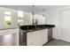 Stylish kitchen with modern appliances and granite countertops overlooking a spacious living area at 1111 W University Dr # 3016, Tempe, AZ 85281