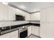 Modern kitchen featuring sleek white cabinetry, stainless steel appliances, and dark granite countertops at 1111 W University Dr # 3016, Tempe, AZ 85281