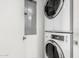 Efficient laundry room features stacked washer and dryer plus electrical panel box at 1111 W University Dr # 3016, Tempe, AZ 85281