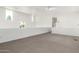 Open living room features neutral tile flooring, white walls, and natural light from large windows at 1111 W University Dr # 3016, Tempe, AZ 85281