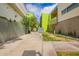 Brightly painted residential buildings with walkway, landscaping, and secure fencing create a modern community aesthetic at 1111 W University Dr # 3016, Tempe, AZ 85281
