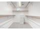 Organized walk-in closet with shelves, rods, and a neutral color palette, offering ample storage space at 1111 W University Dr # 3016, Tempe, AZ 85281
